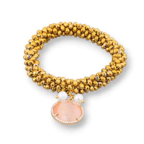 Bracelet élastique avec cristaux entrelacés et pendentif avec oeil de chat et zircons dorés