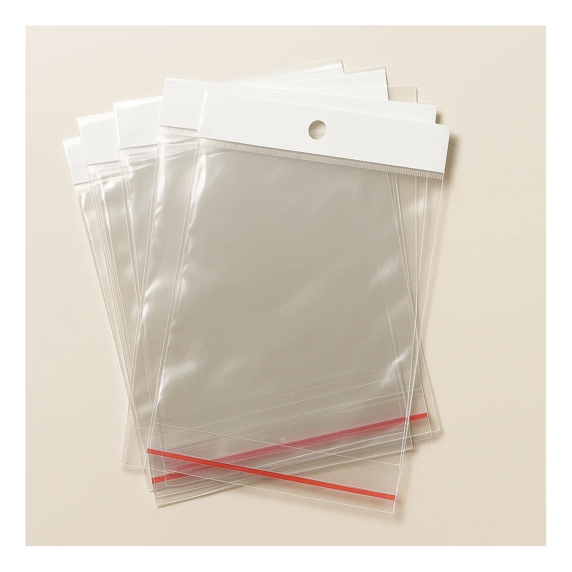 Bolsas de plástico adhesivas con agujero 4x5+2,5cm 200uds-SOBRES ADHESIVOS TRANSPARENTES PARA EMBALAJE DE JOYERÍA Y BISUTERÍA | Worldofjewel.com