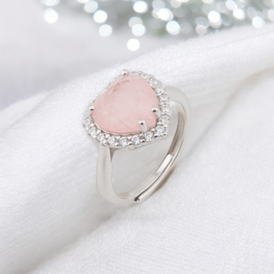 Ring aus 925er Silber mit Zirkonia und weiteren Steinen in einer rosa rhodinierten Herzfassung-RINGE AUS 925 SILBER | Worldofjewel.com