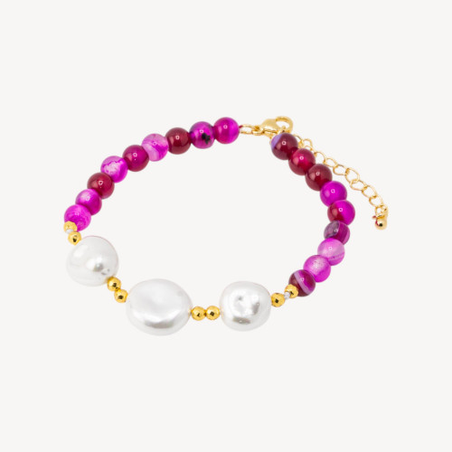 Bracelet orné de pierres semi-précieuses et de trois perles de Majorque (18,5 cm + 5 cm), d'hématite dorée et d'agate fuchsia.